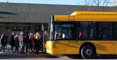 passengers in bus queue